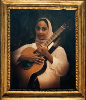framed portrait of amina holding her acoustic guitar